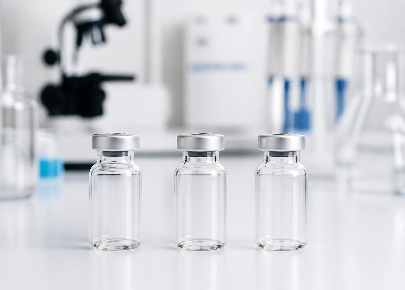 VeltrixLab research vials with white labels on a laboratory bench